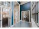 Bright sun room featuring a wall of sliding glass doors and tile flooring at 611 N Park Ave # 108, Indianapolis, IN 46204