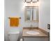 Bathroom with quartz vanity and modern light fixture at 6263 Behner Way, Indianapolis, IN 46250