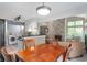 Open-concept dining area adjacent to the kitchen and living room at 6263 Behner Way, Indianapolis, IN 46250