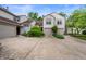 Charming townhome featuring an attached two-car garage, well-maintained landscaping, and a cozy, inviting facade at 6263 Behner Way, Indianapolis, IN 46250