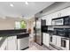 Well-equipped kitchen featuring stainless steel appliances and ample countertop space at 6263 Behner Way, Indianapolis, IN 46250