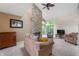 Spacious living room featuring a stone fireplace, vaulted ceilings, and comfortable furnishings at 6263 Behner Way, Indianapolis, IN 46250