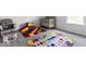 Cozy Bedroom with a rocking chair, crib, and colorful alphabet-themed rug at 628 Tess Blvd, Westfield, IN 46074