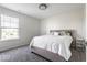 Neutral bedroom with a large window, comfortable bed, and carpeted floors at 628 Tess Blvd, Westfield, IN 46074