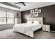 Comfortable bedroom with a neutral color palette, tray ceiling, ceiling fan, and carpeted floors at 628 Tess Blvd, Westfield, IN 46074