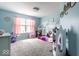 Bright bedroom with a cozy design, plush carpet, and a charming play area at 628 Tess Blvd, Westfield, IN 46074