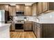 Modern kitchen featuring stainless steel appliances, gray cabinets and white countertops at 628 Tess Blvd, Westfield, IN 46074