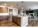 Bright, open kitchen with a stainless steel dishwasher, kitchen island and open to the living room at 628 Tess Blvd, Westfield, IN 46074