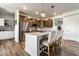 Beautiful open kitchen featuring stainless steel appliances, a kitchen island, and bar stool seating at 628 Tess Blvd, Westfield, IN 46074