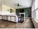 Cozy living room with fireplace, hardwood flooring, and large windows for natural light at 628 Tess Blvd, Westfield, IN 46074