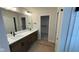 Bathroom with double sinks, tile floor and a walk-in closet in view at 6450 Stone Side Dr, Plainfield, IN 46168