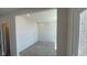 Bright room with fresh white paint and recessed lighting, ready to be personalized into a functional space at 6450 Stone Side Dr, Plainfield, IN 46168