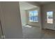A well-lit space featuring a window and a door, ideal for customization into an office or den at 6450 Stone Side Dr, Plainfield, IN 46168