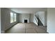 An open living room showcasing a fireplace, staircase, and plenty of natural light at 6450 Stone Side Dr, Plainfield, IN 46168