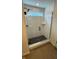 Contemporary shower stall with glass door, black fixtures, and window at 6450 Stone Side Dr, Plainfield, IN 46168