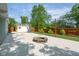 Backyard featuring a fire pit, wooden fence, well-manicured lawn and storage shed at 650 W Main St, Carmel, IN 46032