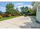 Spacious backyard with wooden fence, manicured lawn, and cozy fire pit at 650 W Main St, Carmel, IN 46032