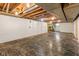 Unfinished basement with exposed wood ceiling beams and large open space at 650 W Main St, Carmel, IN 46032
