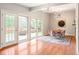 Elegant dining room with stylish decor, ample natural light from large windows, and hardwood floors at 650 W Main St, Carmel, IN 46032