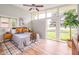 Sun-filled main bedroom with clerestory windows, ceiling fan, and decorative plant at 650 W Main St, Carmel, IN 46032