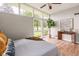 Sun-filled main bedroom with laminate floors, clerestory windows, and view of the yard at 650 W Main St, Carmel, IN 46032