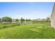 Expansive backyard features a large pond and well-maintained lawn, perfect for outdoor enjoyment at 671 Greenway St, Greenwood, IN 46143
