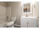 A bright bathroom featuring a tub and shower combo, vanity, and modern finishes at 671 Greenway St, Greenwood, IN 46143