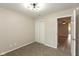 A carpeted bedroom with a light fixture and a closet with folding doors at 671 Greenway St, Greenwood, IN 46143