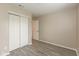 A bedroom with vinyl plank flooring and a closet with sliding doors at 671 Greenway St, Greenwood, IN 46143