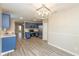 Eat-in kitchen with stainless appliances, modern light fixture, and new flooring for easy maintenance at 671 Greenway St, Greenwood, IN 46143