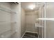 A walk-in closet with vinyl flooring and white, coated metal shelving at 671 Greenway St, Greenwood, IN 46143