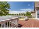 Relax on the deck overlooking the lake, with views of nearby houses and a blue sky at 719 E New Rd, Greenfield, IN 46140
