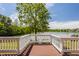 The back deck provides relaxing views of the lake, trees, and nearby properties at 719 E New Rd, Greenfield, IN 46140