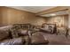 Spacious basement featuring plush carpeting, multiple seating areas, and natural lighting at 719 E New Rd, Greenfield, IN 46140