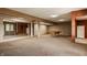 Open finished basement with a pool table, a mirror, and plentiful open space at 719 E New Rd, Greenfield, IN 46140