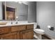 Cozy bathroom featuring light wood vanity, matching framed mirror, and neutral tones at 719 E New Rd, Greenfield, IN 46140