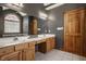 Bathroom features a double vanity, large mirror and a stand alone tub under an arch window at 719 E New Rd, Greenfield, IN 46140