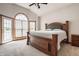 This main bedroom features a large bed, vaulted ceilings, and large windows for natural light at 719 E New Rd, Greenfield, IN 46140