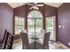 Bright dining area features a chandelier, a glass top table, and natural lighting from the exterior views at 719 E New Rd, Greenfield, IN 46140