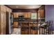 Kitchen featuring stainless steel appliances, wooden cabinets, and a center island with barstool seating at 719 E New Rd, Greenfield, IN 46140