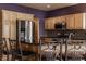 Kitchen featuring stainless steel appliances, granite countertops, wooden cabinets, and an island with barstool seating at 719 E New Rd, Greenfield, IN 46140