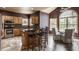 Eat-in kitchen featuring a ceiling fan, natural lighting, stainless steel appliances, and an island with barstool seating at 719 E New Rd, Greenfield, IN 46140