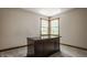 An office featuring a nice desk, trimmed window with natural light, and carpeted floors at 719 E New Rd, Greenfield, IN 46140