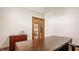 An office area featuring a wood desk, and a set of french doors leading to an adjacent room at 719 E New Rd, Greenfield, IN 46140