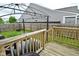 Backyard featuring a wooden deck, gazebo, well-maintained lawn, and privacy fence at 7515 Brattle Dr, Indianapolis, IN 46113