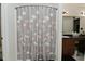 Bathroom with a flower curtain and a sink in the back at 7515 Brattle Dr, Indianapolis, IN 46113