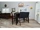 Dining area with a modern light fixture is naturally lit and ready for entertaining at 7515 Brattle Dr, Indianapolis, IN 46113