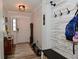 Welcoming entryway with stylish wood-look floors and storage area to keep you organized at 7515 Brattle Dr, Indianapolis, IN 46113