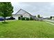Charming single-story home with a well-maintained lawn, truck in driveway, and attractive landscaping at 7515 Brattle Dr, Indianapolis, IN 46113
