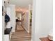 Inviting hallway featuring wood-look floors and mud room with storage and decorative wall decor at 7515 Brattle Dr, Indianapolis, IN 46113